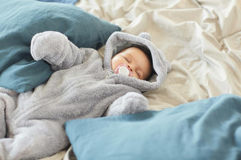 Cute Baby Sleeping on Big Comfortable Bed