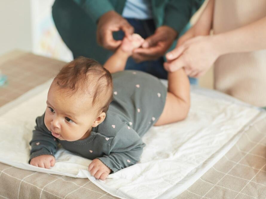 Parents Massaging Baby