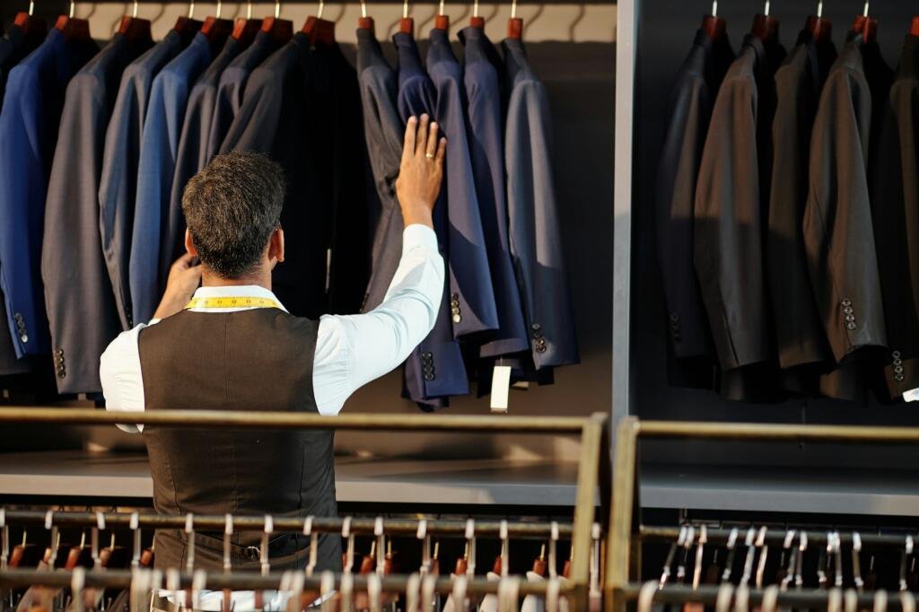 Tailor checking bespoke jackets