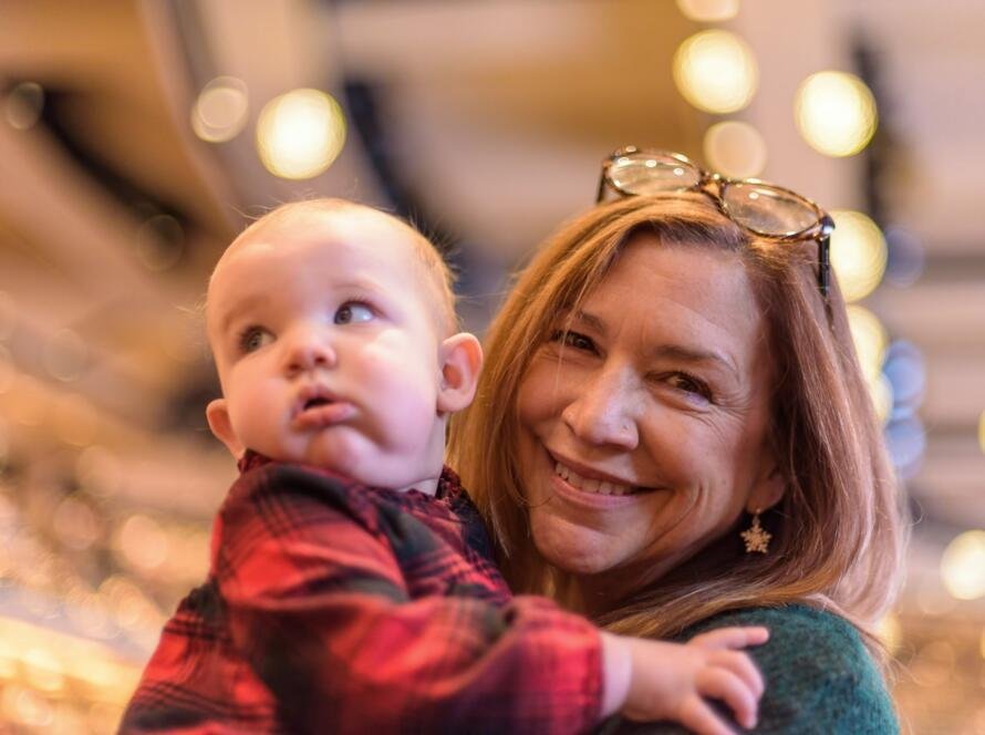 Woman holding baby at Christmas service