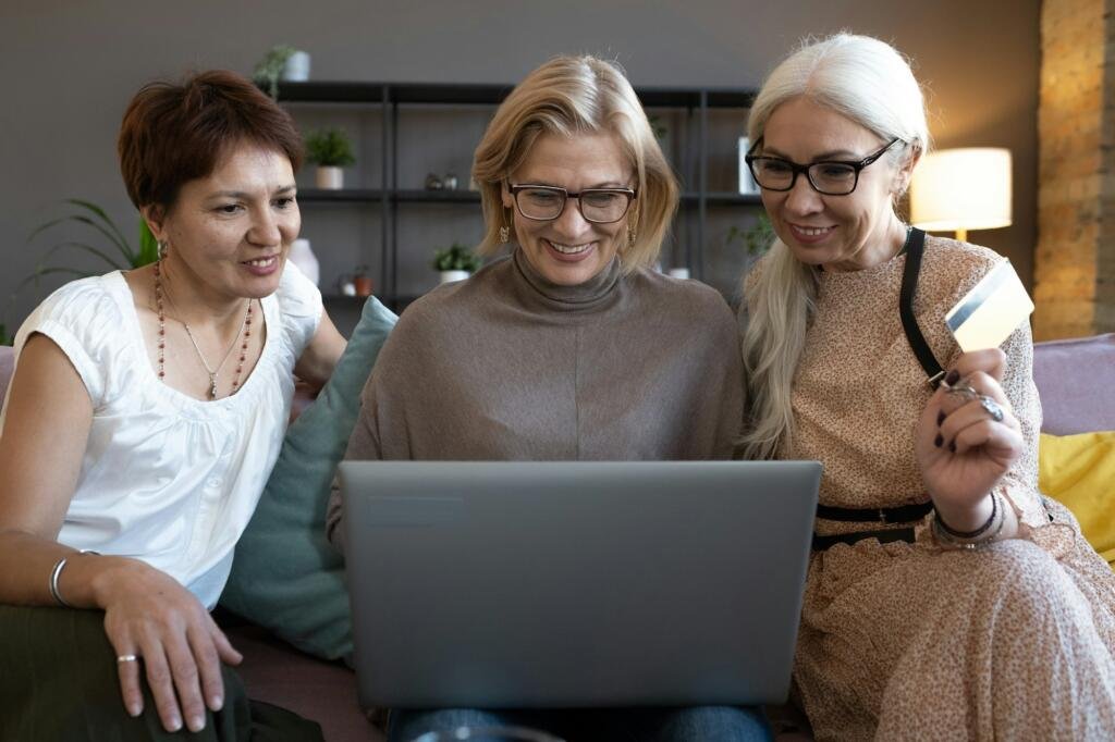 Women shopping online with computer