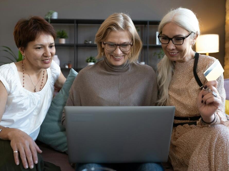 Women shopping online with computer