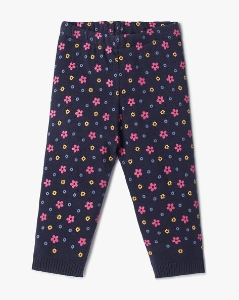 Navy blue leggings with a multicoloured floral pattern.