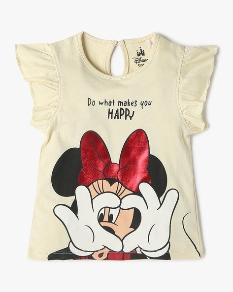 A children's t-shirt with a design of an animated character making a heart shape with her hands, wearing a large red bow, and surrounded by the words "Do what makes you HAPPY".