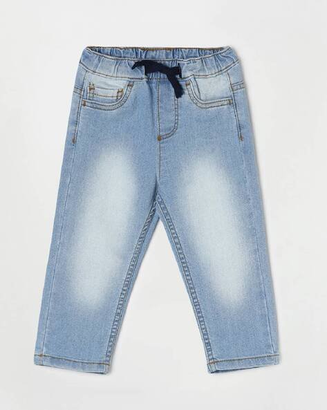 Light blue children's denim jeans with a black drawstring and faded detailing.