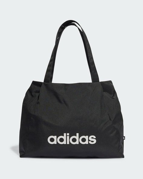 Black Adidas tote bag with white logo.