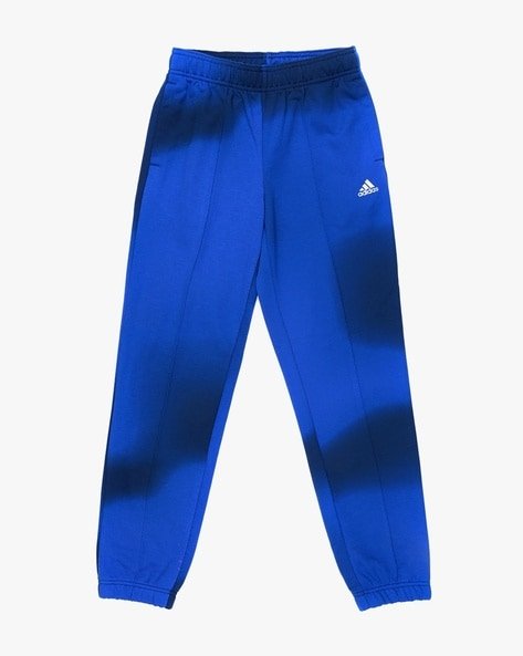 Blue Adidas track pants with an elastic waistband and cuffs, featuring the Adidas logo.