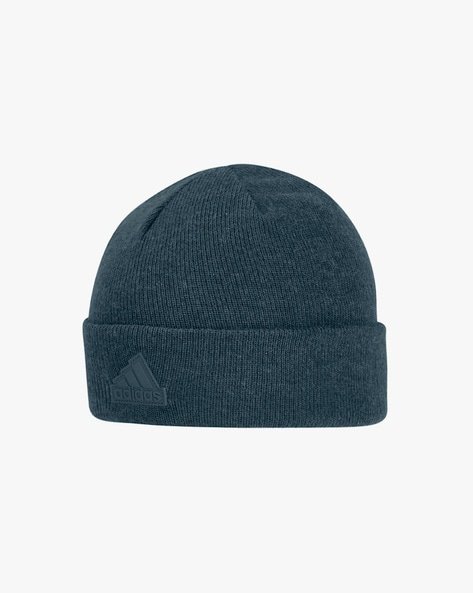 Dark green knitted beanie with a folded brim and an Adidas logo on the front.