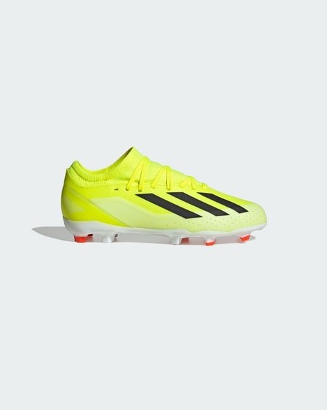 Bright yellow football boot with black stripes and red-tipped studs.